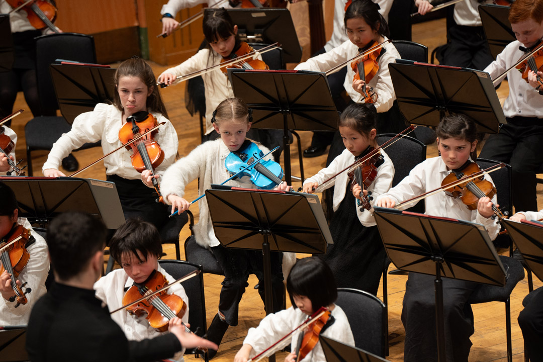 Children playing string instruments